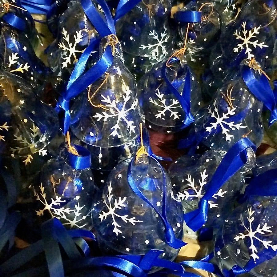 Blue bell Christmas decoration with glass dong in Hebron blue recycled glass. Painted with white snowflake hanging on blue ribbon.