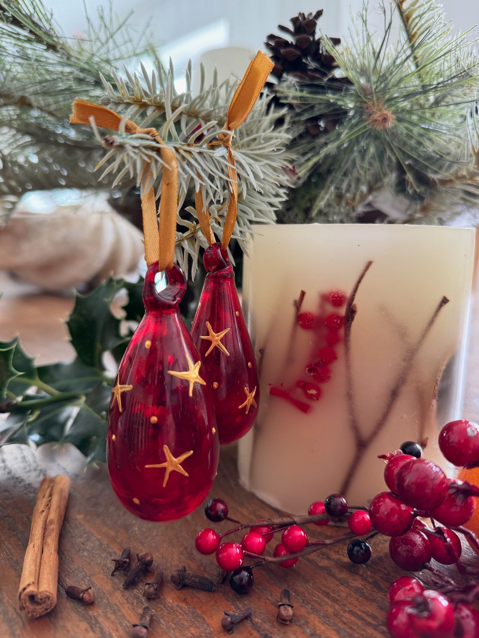 Mini glass Christmas baubles painted with gold stars and hanging on gold ribbon. handmade in Bethlehem