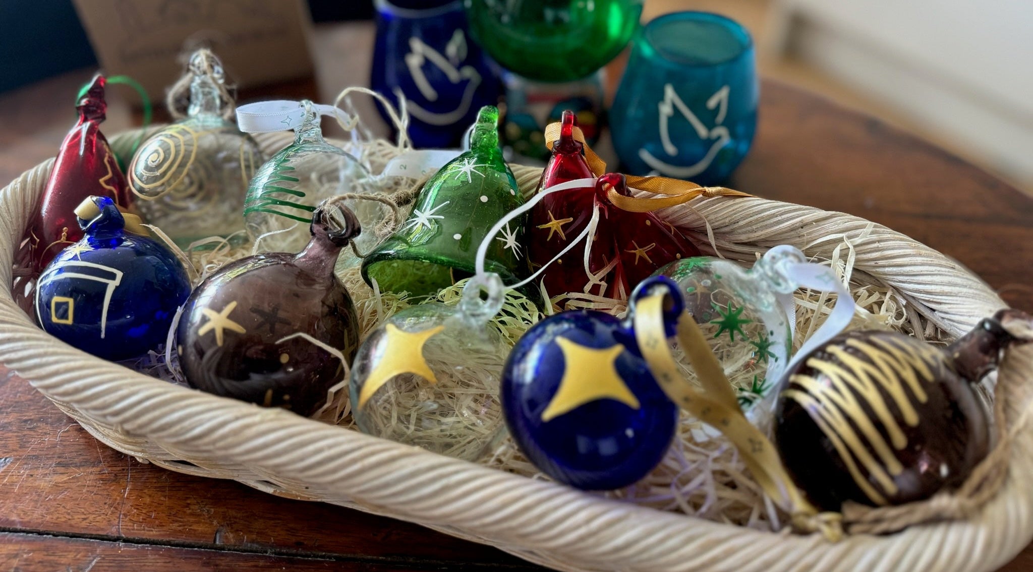 red, clear, green, plum, aubergine, blue, turquoise recycled glass decorations Christmas and easter. Handmade in Bethlehem